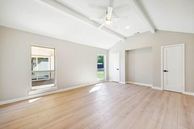 empty room with ceiling fan, light hardwood / wood-style flooring, and vaulted ceiling with beams