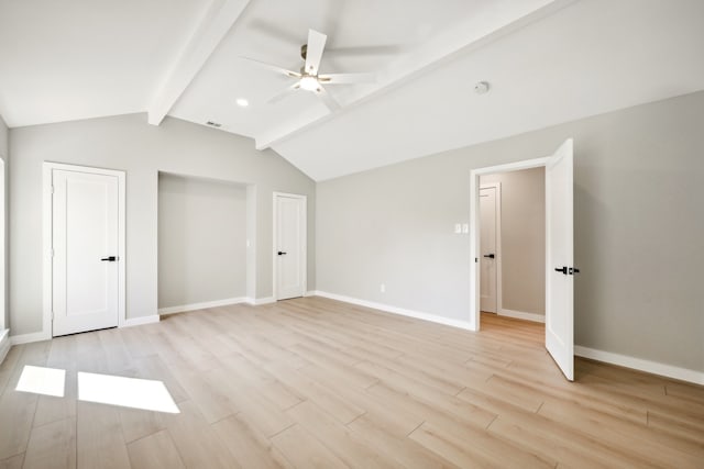 unfurnished bedroom featuring lofted ceiling with beams, light wood-type flooring, and ceiling fan