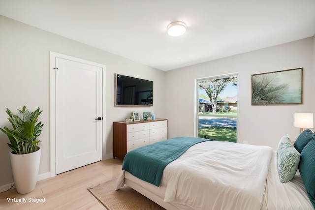 bedroom featuring light hardwood / wood-style floors