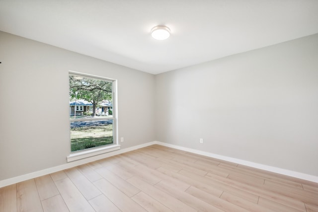 unfurnished room with light hardwood / wood-style flooring