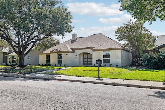 view of front of home with a front lawn