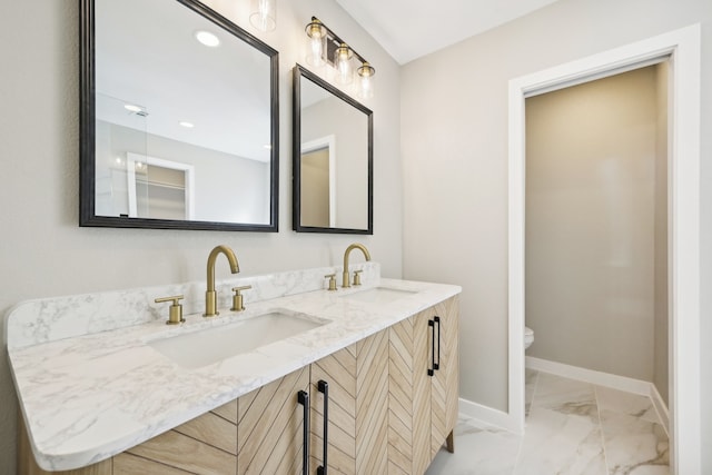 bathroom with vanity and toilet