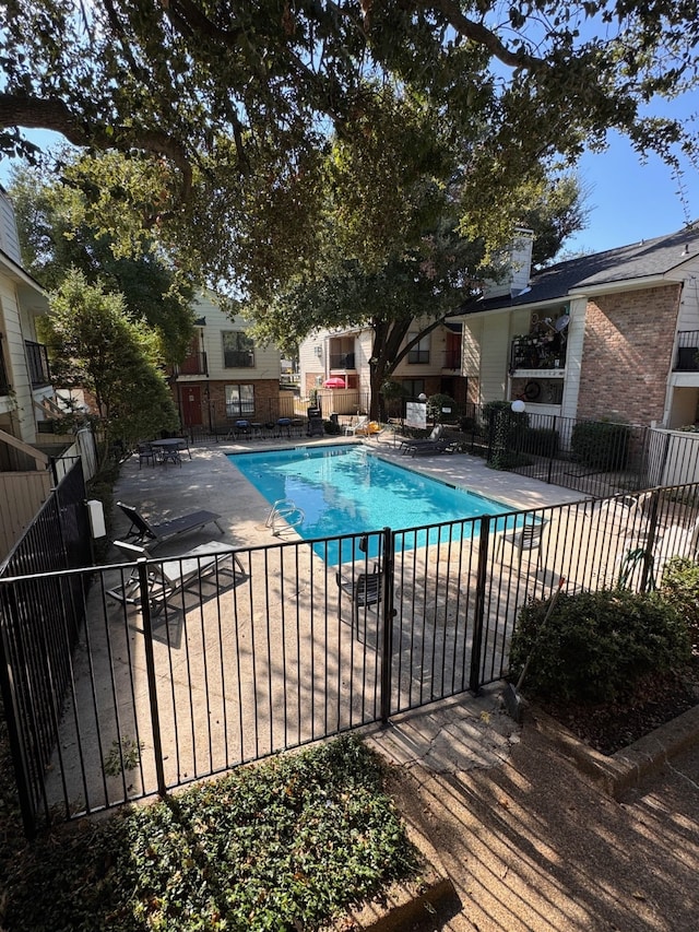 view of pool featuring a patio