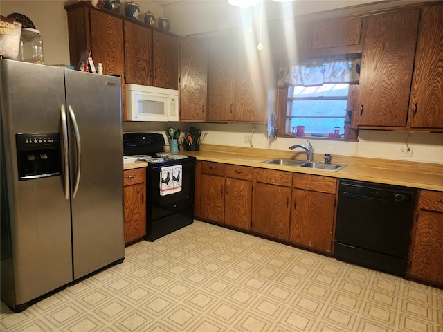 kitchen with black appliances and sink