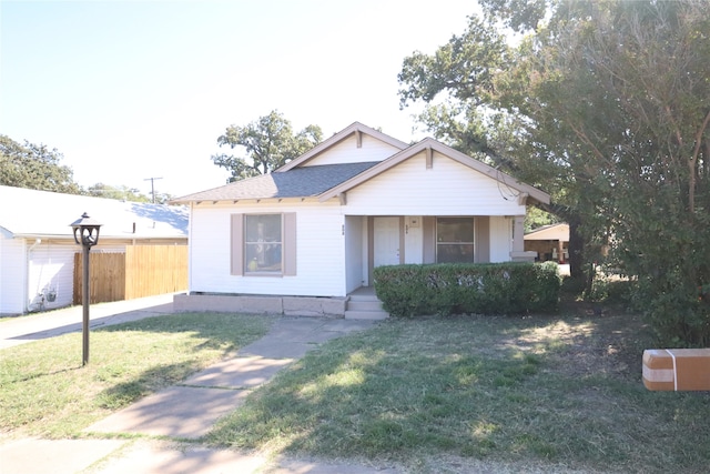 view of front of property with a front lawn