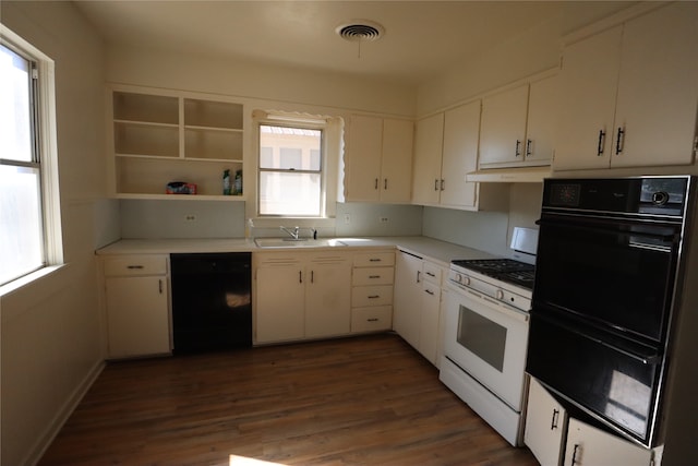 kitchen with white cabinetry, black appliances, sink, and dark hardwood / wood-style floors