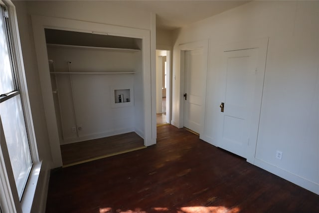 clothes washing area featuring washer hookup and dark hardwood / wood-style flooring