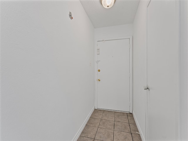 full bathroom featuring tile patterned floors, vanity, toilet, and tiled shower / bath combo