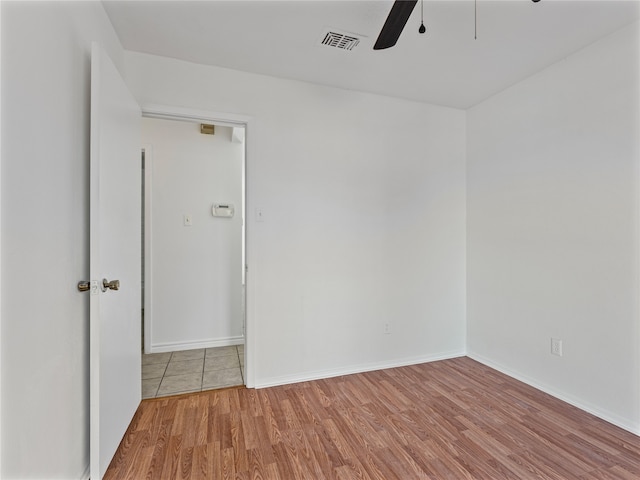 tiled spare room with french doors, a textured ceiling, a wealth of natural light, and ceiling fan