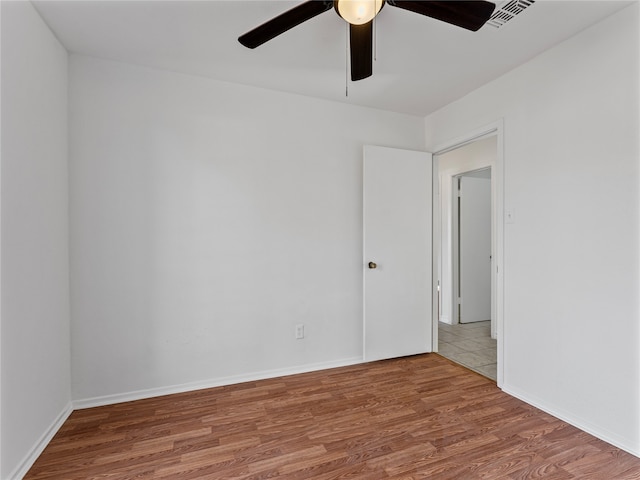 tiled empty room featuring ceiling fan, a textured ceiling, and french doors