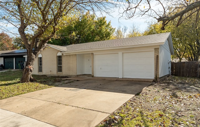 ranch-style home with a garage