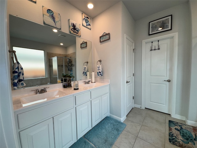 bathroom with vanity, tile patterned floors, and a shower with shower door