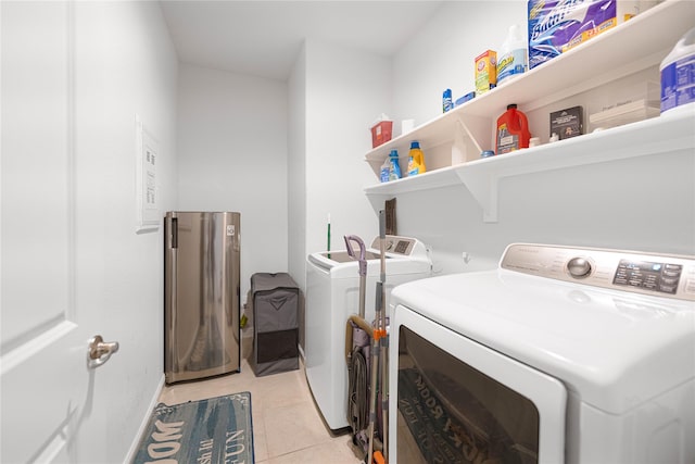 1020 Nicole Way, Fort Worth, TX 76028 - washroom with separate washer and dryer, light tile patterned floors, and laundry area