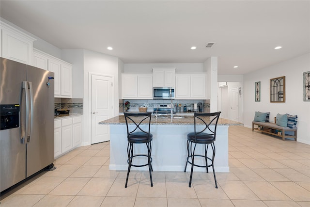 1020 Nicole Way, Fort Worth, TX 76028 - kitchen with white cabinetry, light tile patterned floors, a sink, visible vents, and appliances with stainless steel finishes