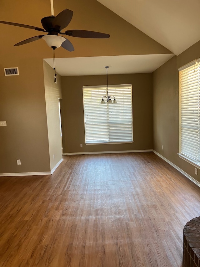 interior space with light hardwood / wood-style floors, lofted ceiling, and plenty of natural light