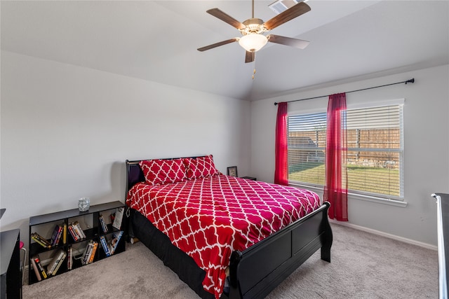 bedroom featuring ceiling fan, carpet, and vaulted ceiling