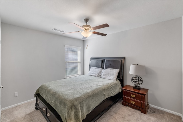 bedroom featuring ceiling fan and light colored carpet