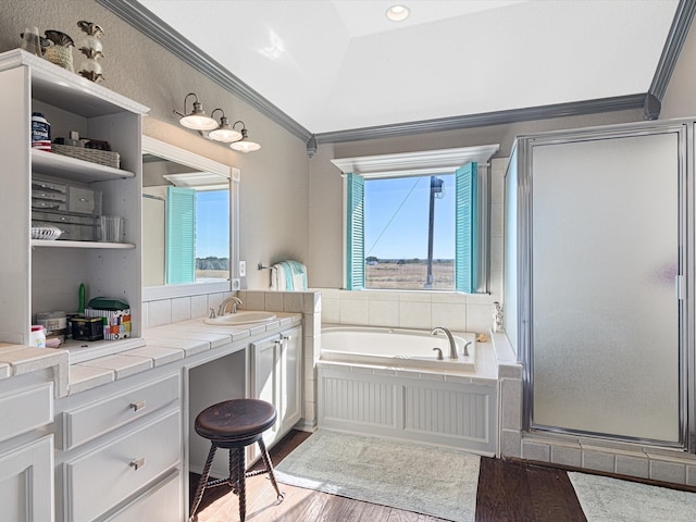 bathroom with wood-type flooring, lofted ceiling, shower with separate bathtub, and a healthy amount of sunlight