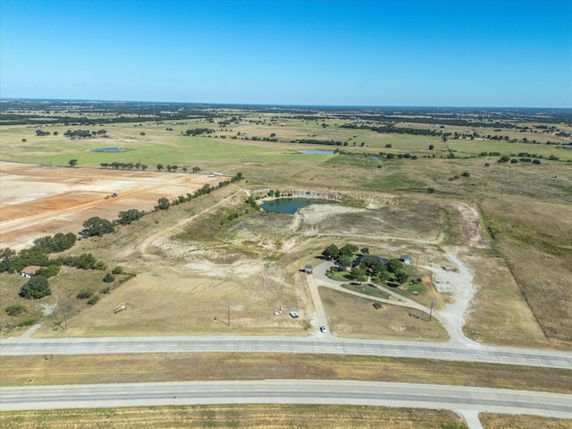 aerial view with a rural view and a water view