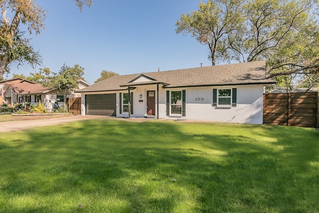 ranch-style home featuring a front yard and a garage