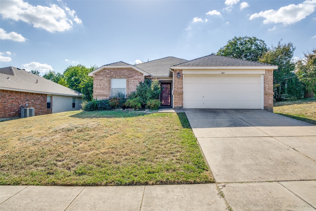 ranch-style home with central AC, a front yard, and a garage