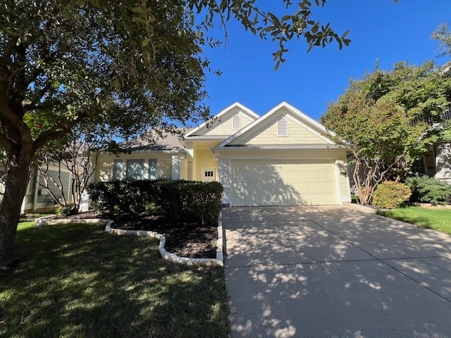 view of front of house featuring a front yard and a garage