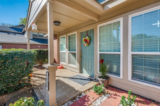 property entrance featuring covered porch