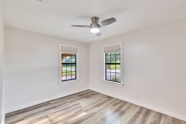 unfurnished room featuring light hardwood / wood-style floors and ceiling fan