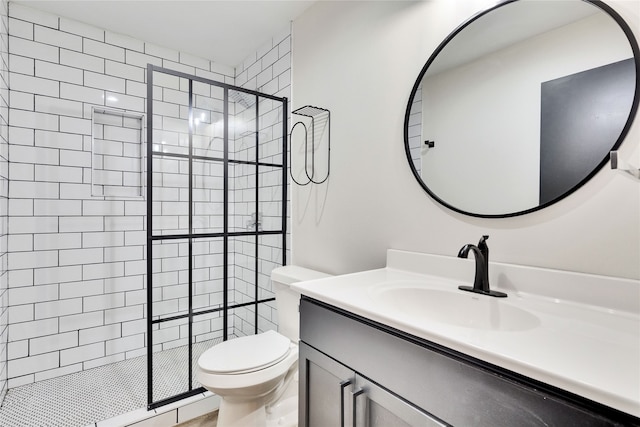 bathroom with vanity, toilet, and a shower with shower door