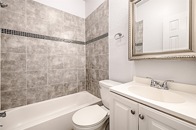 full bathroom with vanity, toilet, and tiled shower / bath