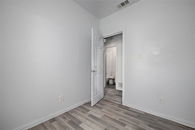 spare room with light hardwood / wood-style flooring