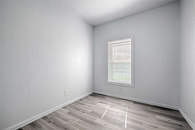 empty room with light wood-type flooring