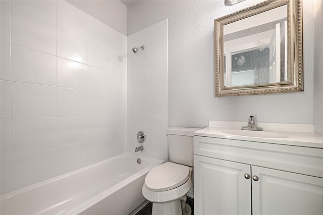 full bathroom with vanity, toilet, and tiled shower / bath