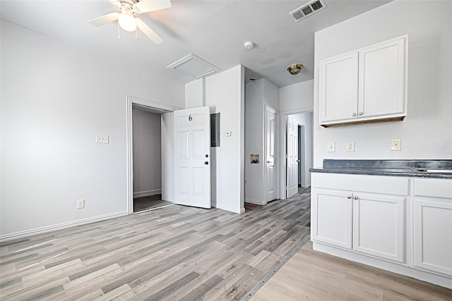 kitchen with white cabinetry, ceiling fan, and light wood-type flooring