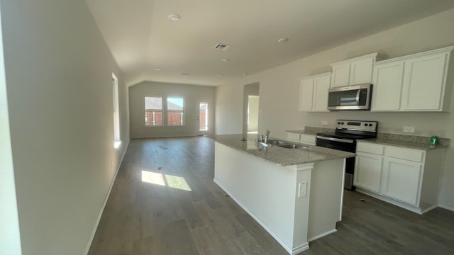 kitchen featuring stainless steel appliances, dark hardwood / wood-style floors, sink, an island with sink, and white cabinets