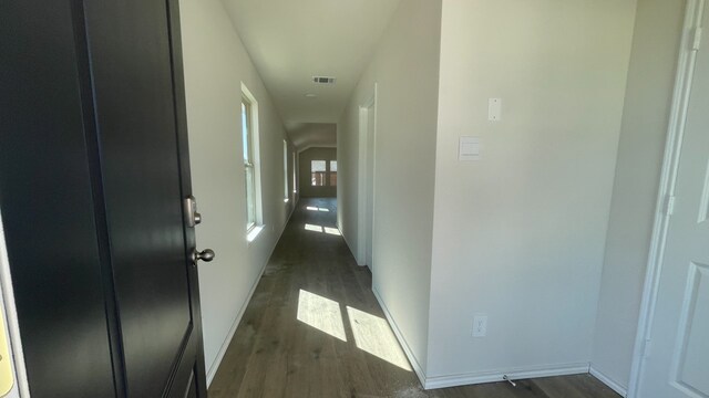 hallway with dark wood-type flooring