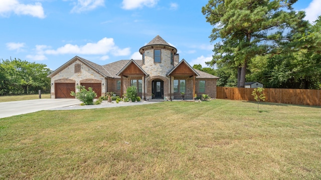 view of front facade with a front lawn and a garage