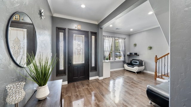 foyer entrance featuring wood-type flooring and ornamental molding