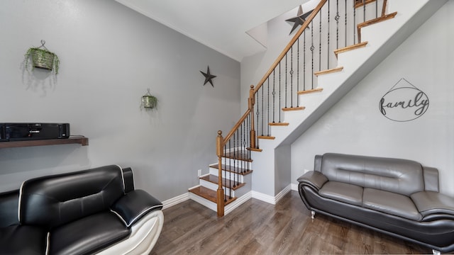 interior space featuring hardwood / wood-style floors and crown molding