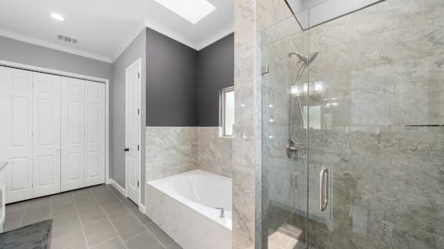 bathroom with separate shower and tub, tile patterned flooring, ornamental molding, and a skylight