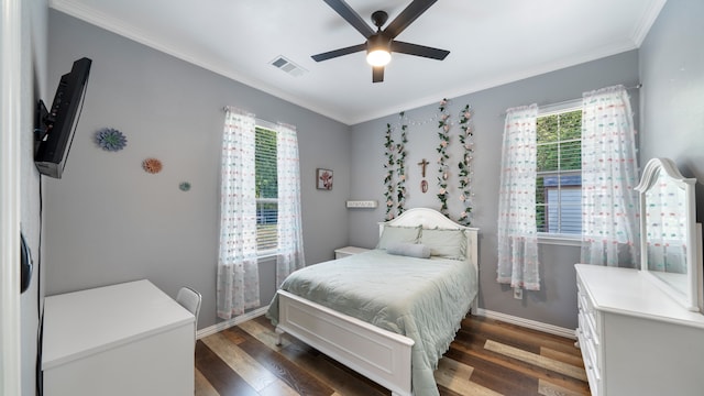 bedroom featuring dark hardwood / wood-style flooring, ornamental molding, and ceiling fan