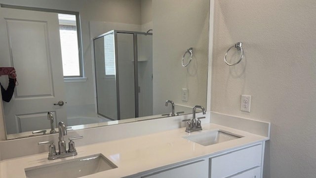 bathroom with independent shower and bath and vanity