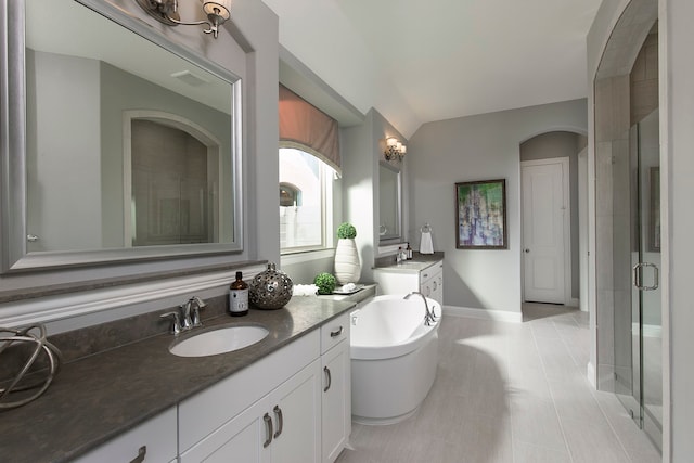 bathroom with vanity, plus walk in shower, and tile patterned flooring