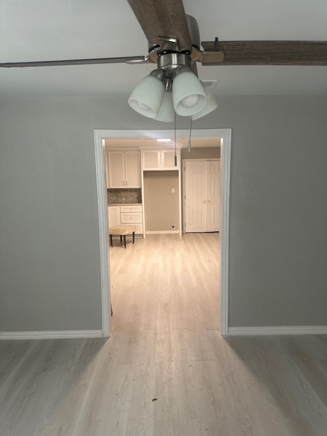 unfurnished dining area with light hardwood / wood-style floors and ceiling fan