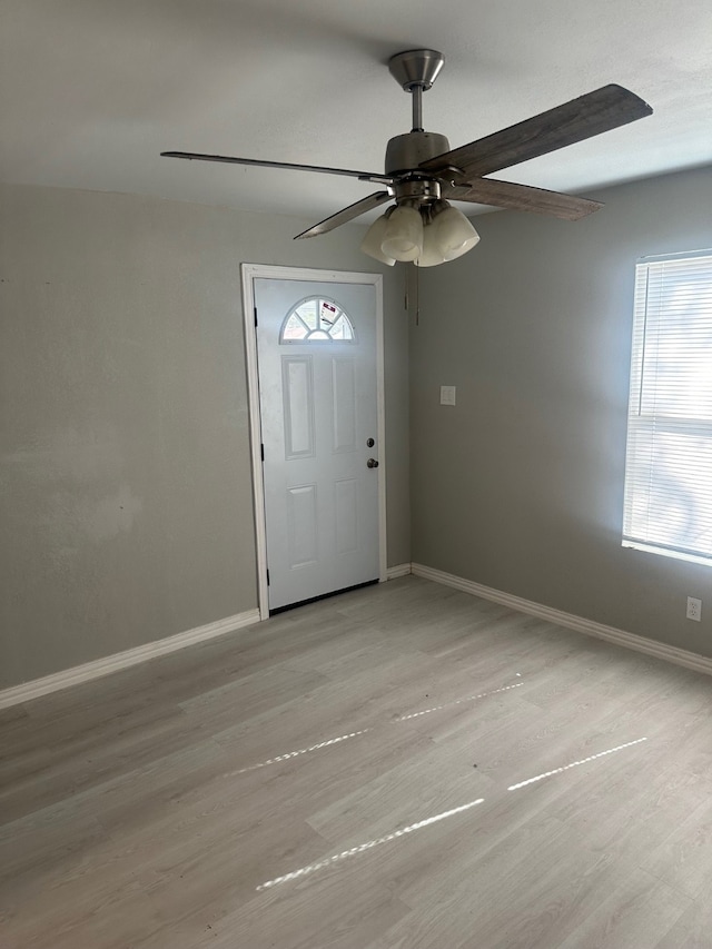 entrance foyer with light hardwood / wood-style flooring and ceiling fan