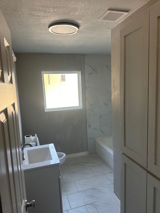 full bathroom with vanity, a textured ceiling, shower with separate bathtub, and toilet