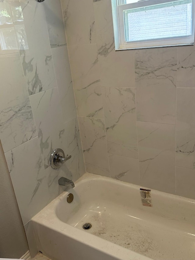 bathroom with shower / tub combination