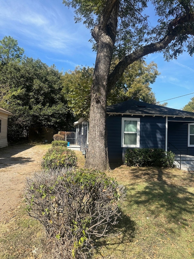 view of home's exterior featuring a yard