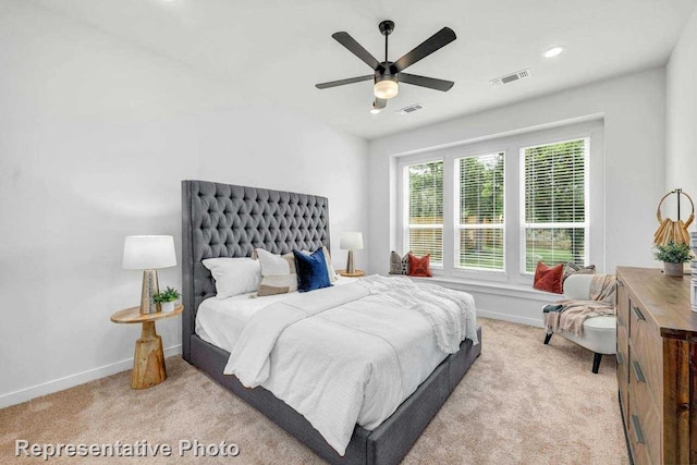 carpeted bedroom featuring ceiling fan