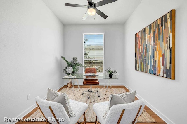 office with hardwood / wood-style floors and ceiling fan